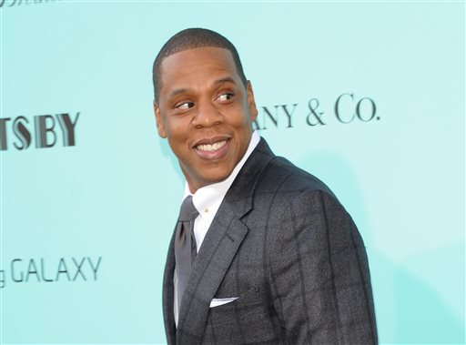 In this May 1, 2013 file photo, Jay-Z arrives at "The Great Gatsby" world premiere in New York Citys  Avery Fisher Hall. In a statement posted on his website on Friday, Nov. 15, 2013, the entertainer said that hes planning to move forward with his scheduled collaboration with Barneys New York despite allegations that black shoppers had been racially profiled at the high-end retailer.  The posting went on to state that he agreed to the launch of his BNY SCC collection under the condition he could serve on a newly-created council convened by the store to deal with racial profiling. (Photo by Evan Agostini/Invision/AP, File)