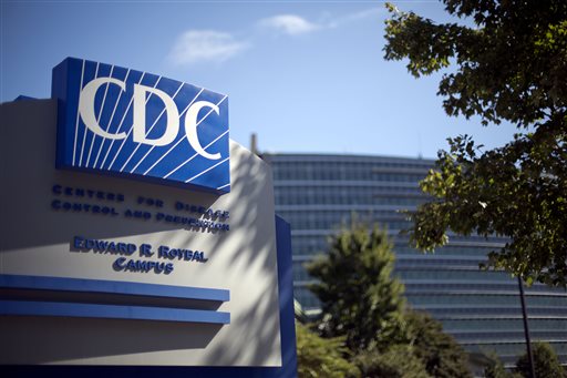 In this Tuesday, Oct. 8, 2013, file photo, a sign marks the entrance to the federal Centers for Disease Control and Prevention,in Atlanta. The agency released its first progress report Thursday, and CDC officials said they're mostly pleased. (AP Photo/David Goldman, File)