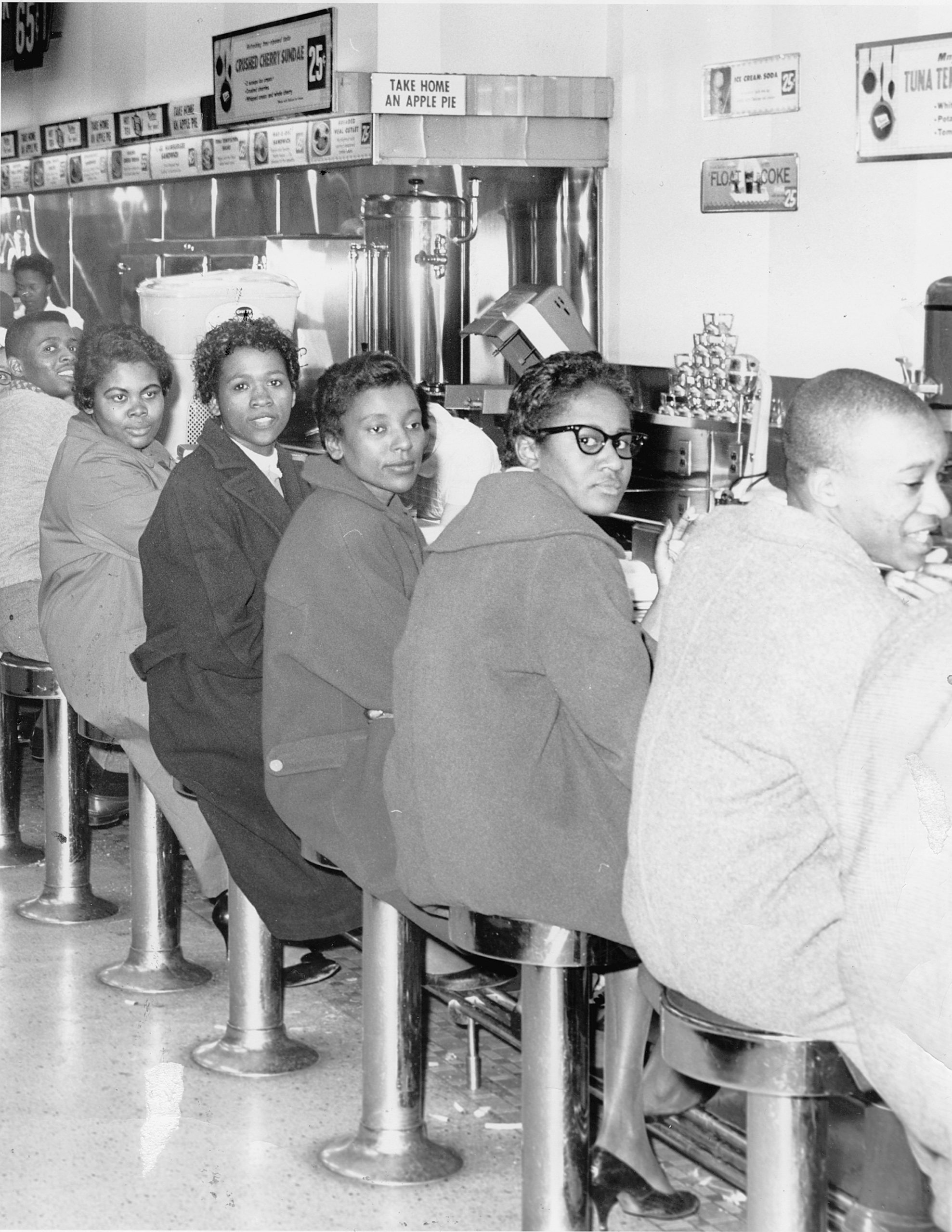 Students from Norfolk’s Booker T. Washington High School stage set in at Granby Street’s Woolworth’s lunch counter. Photo: New Journal and Guide Archives