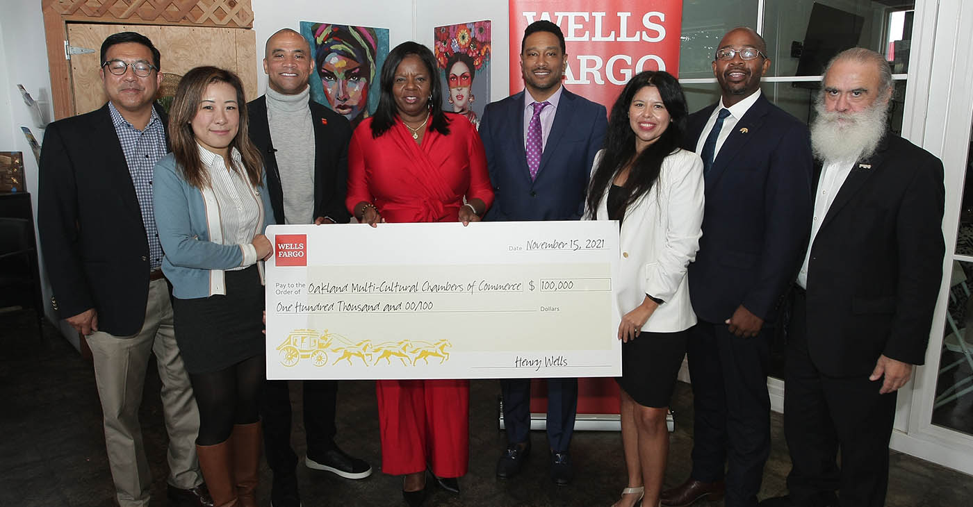 The Multi-Cultural Chamber of Commerce received a check for $100,000 from Wells Fargo. Present were (left to right): Rick Da Silva Oakland Chinatown Chamber of Commerce; Jessica Chen, Oakland Chinatown Chamber of Commerce; Chuck Baker, Wells Fargo; Cathy Adams, Oakland African American Chamber of Commerce; Ken Maxey, Oakland Metropolitan Chamber of Commerce; Erica Trejo, Wells Fargo; Oakland Councilmember Loren Taylor and Joe Partida, Oakland Latino Chamber of Commerce. Photo by Auintard Henderson.