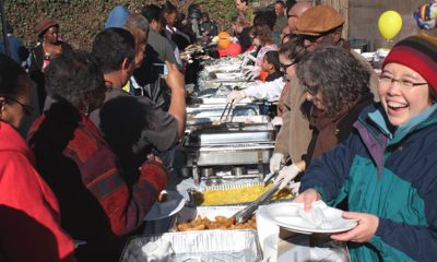 Community residents (left) and volunteers (right) participating in Two Star Market's Annual Thanksgiving Community Celebration last year. Photo courtesy of Two Star Market.