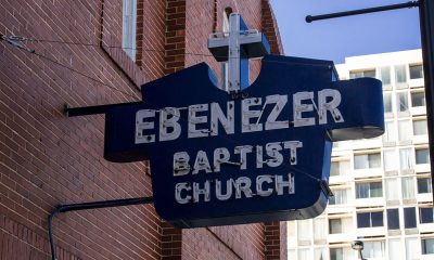 A blue and white sign marks the home of Ebenezer Baptist Church where Martin Luther King Jr. preached in Atlanta.