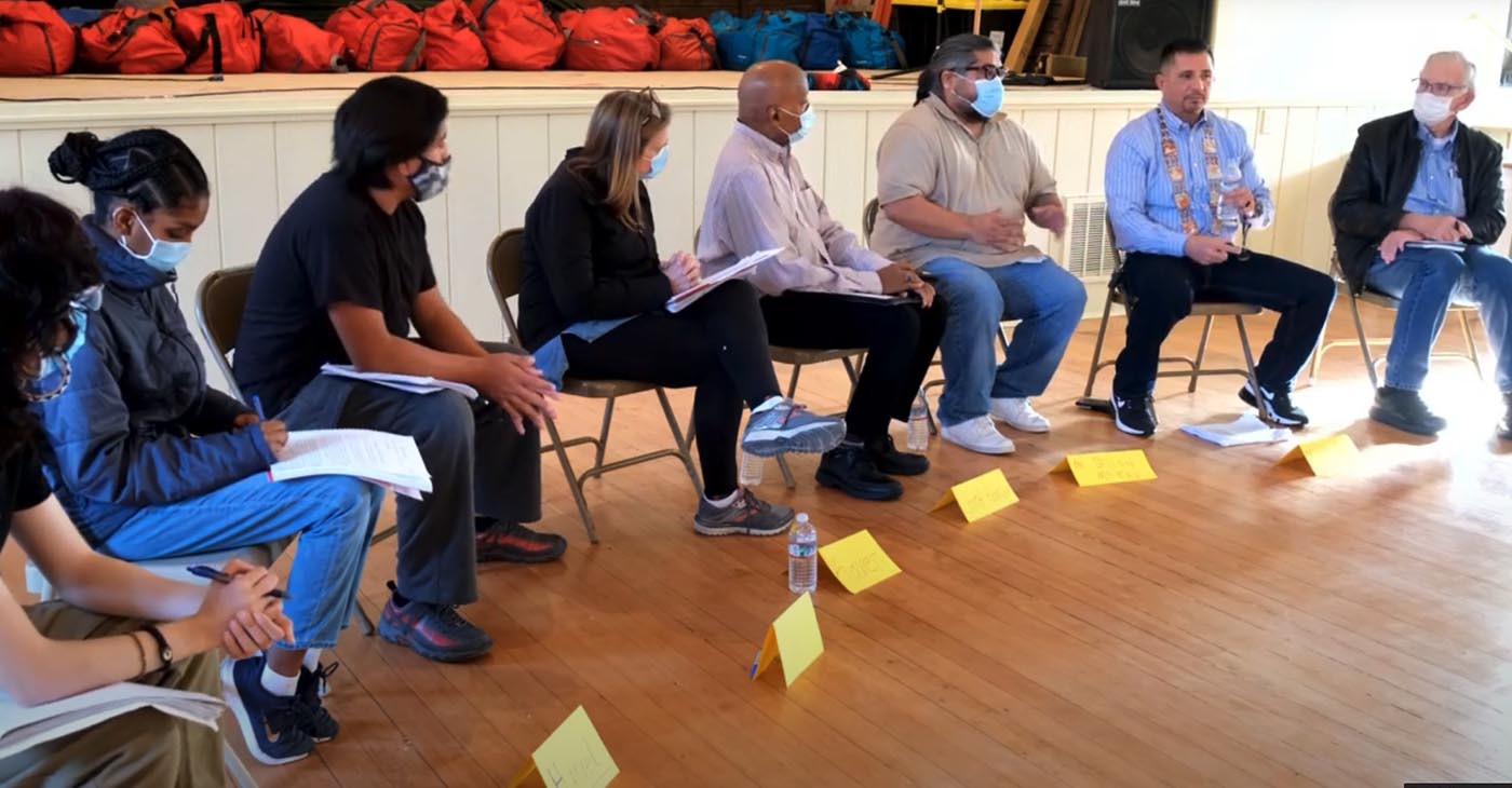 Dillon McKay (in tan shirt wearing blue mask), Laverne Bill (in Blue shirt with abalone shell necklace), Martin Luther King Jr, Freedom Center Executive Director Dr. Roy D. Wilson (in black jacket and blue mask) with Freedom Center students.