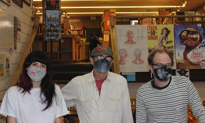Moe’s Books Union members Phoebe Wong (left), Owen Hill (center), and Bradley Skaught (right) pose inside the Berkeley bookstore on November 30. Photo by Zack Haber.