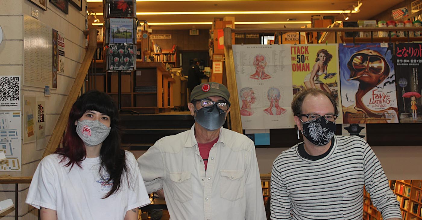 Moe’s Books Union members Phoebe Wong (left), Owen Hill (center), and Bradley Skaught (right) pose inside the Berkeley bookstore on November 30. Photo by Zack Haber.
