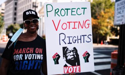A participant in the “Protect Voting Rights” march on Wash., D.C., on Aug. 28, 2021. Photo by Johnny Silvercloud/Shutterstock.