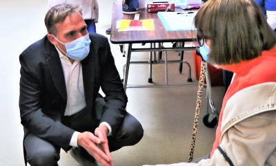 Dr. Matt Willis, Marin County Public Health Officer, speaks with a woman at a COVID-19 vaccination clinic earlier this year.