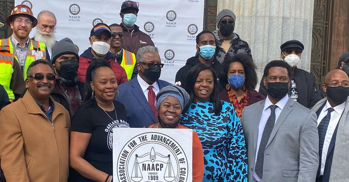 First Row left to right: John Baptiste, Black Contractor, Antoinette Clark, NAACP, Bendu Griffin, Professional Services Consultants, Cathy Adams, OAACC, Stanley Cooper, Chair of Labor and Industry , NAACP Oakland Branch & Cooper Construction and Engineering, Councilmember Loren Taylor, District 6; Second Row left to right: Mario Wagner, NAACP Oakland Branch, George Holland, Sr., President NAACP, Oakland Branch, Jumoke Hinton, NAACP, Oakland Branch; Upper row: Nick Colina Anco Iron & Construction, Inc. & NAMC , co-founder Build Out California, Joe Patida, President of the Latino Chamber of Commerce, Derrick Johnson, representing the LGBTQ Community Center, Baasim Khufu, NAMC, Black Contractor, Jonathan “Fitness” Jones, (Post Newspaper Group) and Clifton Cooper, Vice President, NAACP Oakland. Photo by Auintard Henderson.