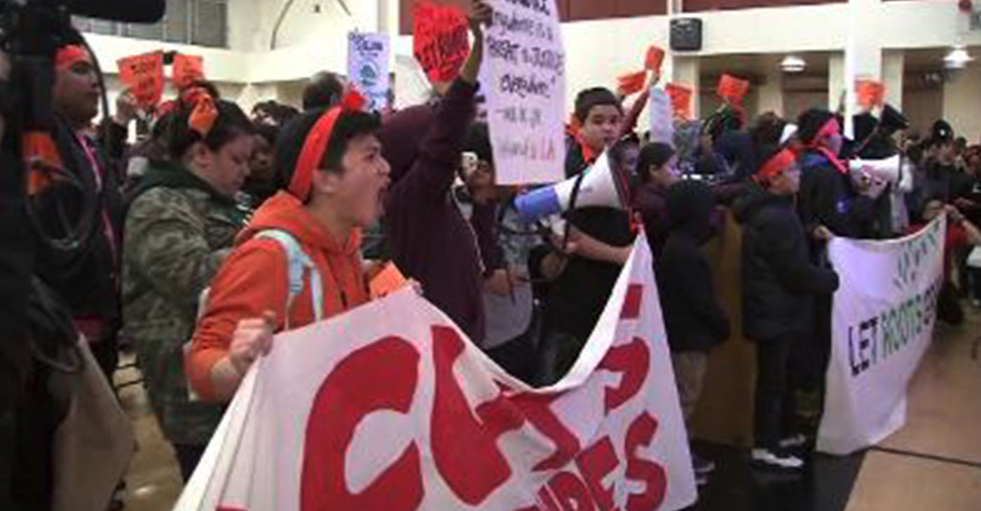 Students, parents and teachers protested in January 2019 against the closure of Roots International Academy in East Oakland as the school board voted to permanently close the school - under the guidance of the Fiscal Crisis Management and Assistance Team(FCMAT) and Karen Monroe of Alameda County Office of Education. Photo courtesy of ABC7.