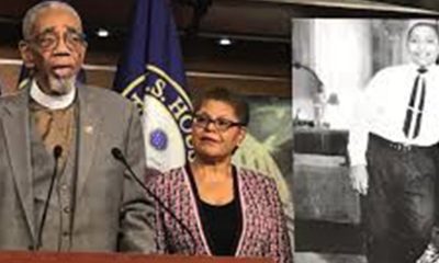 Rep. Bobby Rush, who represents the Chicago district where Emmett Till lived, and Los Angeles Rep. Karen Bass with a photo of Emmett Till speaking before the House passed the bill last month. Photo courtesy of Rush press office.