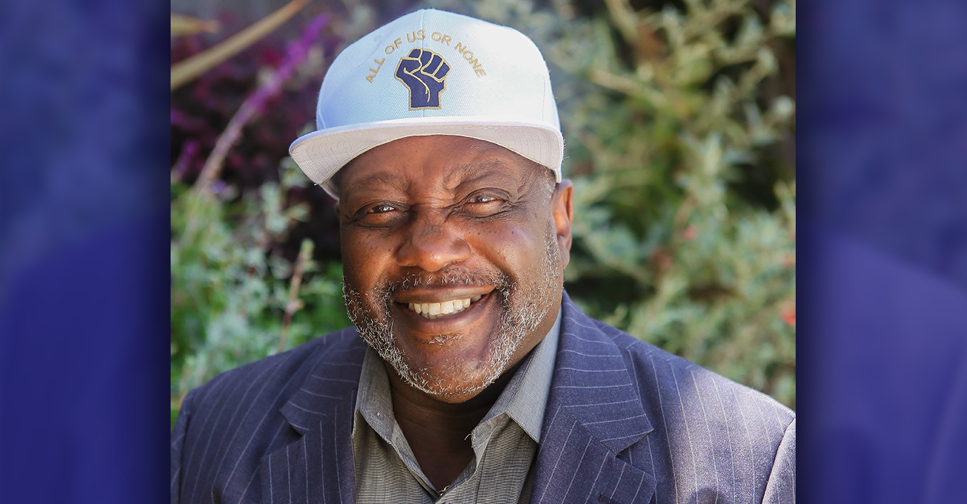Dorsey Nunn dons his “All of Us or None” cap with a smile.