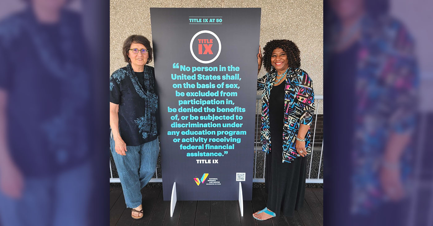 37 Words Author Sherry Boschert in front of poster with keynote speaker Pamela Price. (Photo courtesy of Price).