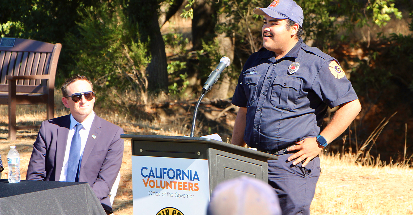 Juan Armando Jimenez, a participant in the Marin County Fire Department’s FIRE Foundry program, speaks about his experience as California Chief Service Officer Josh Fryday looks on during a press conference Aug. 23, 2022, at College of Marin’s Indian Valley Campus in Novato.