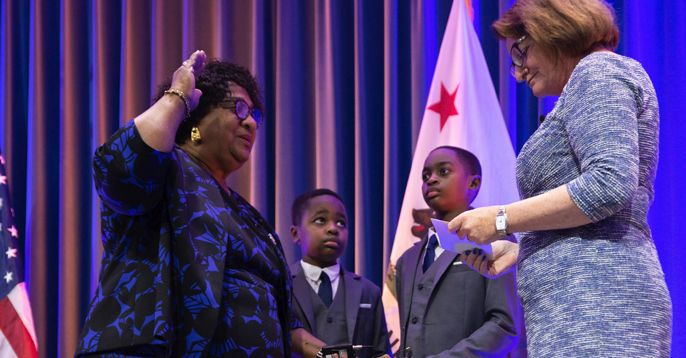 As her grandchildren Kadir and Jalil Gakunga looked on California Secretary of State Shirley Weber was sworn in to her first term in the position by Senate President pro Tempore Toni G. Atkins (D-San Diego). CBM photo.