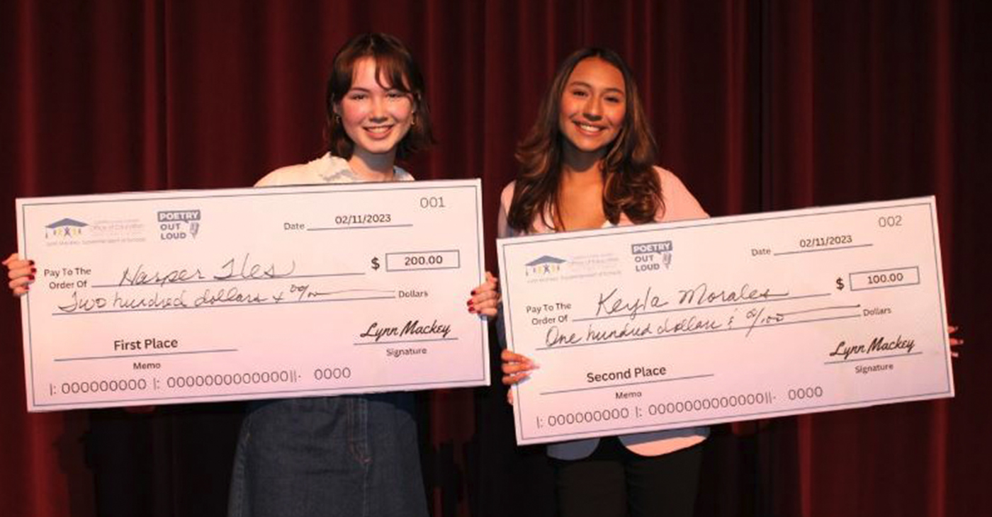 Harper Iles, left, and Kayla Morales each hold the scholarship checks they received for winning in the Poetry Out Loud competition on Feb. 11. Photo courtesy of Contra Costa County Office of Education.