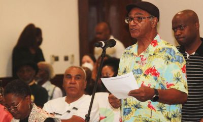 Elmer Fonza, right, speaks during public comment at the California Reparations Task Force Meeting in Los Angeles on Sept. 23, 2022. Fonza and his brother Medford, seated on the left, want to know if a proposed Freedmen’s Bureau could help them file a claim in regard to property once owned in Gold County by their formerly enslaved great-great-great grandfather. Photo by Antonio Ray Harvey