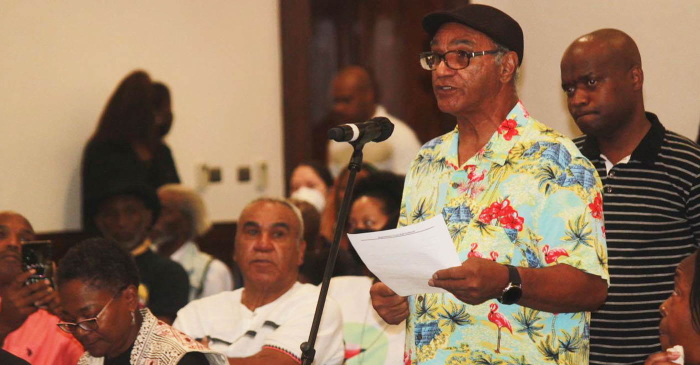 Elmer Fonza, right, speaks during public comment at the California Reparations Task Force Meeting in Los Angeles on Sept. 23, 2022. Fonza and his brother Medford, seated on the left, want to know if a proposed Freedmen’s Bureau could help them file a claim in regard to property once owned in Gold County by their formerly enslaved great-great-great grandfather. Photo by Antonio Ray Harvey