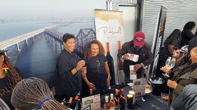 Paula Harrell, left, owner of P. Harrell Wines with staff at the Black Vines: A Toast to Black Wineries, Black Art and Black Culture 12th anniversary event. Photo By Carla Thomas 