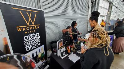 Wachira Wines staff pour samples of wine at the Black Vines: A Toast to Black Wineries, Black Art and Black Culture 12th anniversary event. Photo By Carla Thomas 