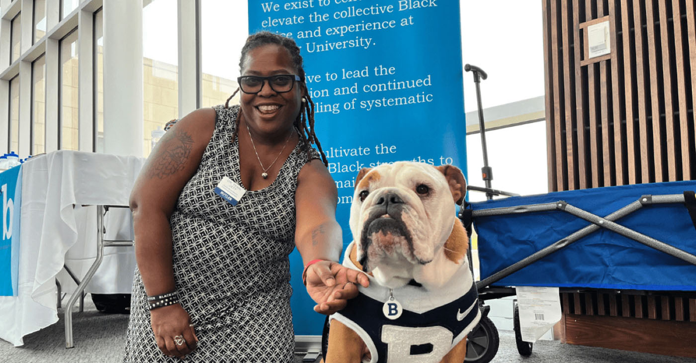 Dr. Terri Jett poses with Butler Blue, the mascot of Butler University. Photo courtesy of Butler University Stories.