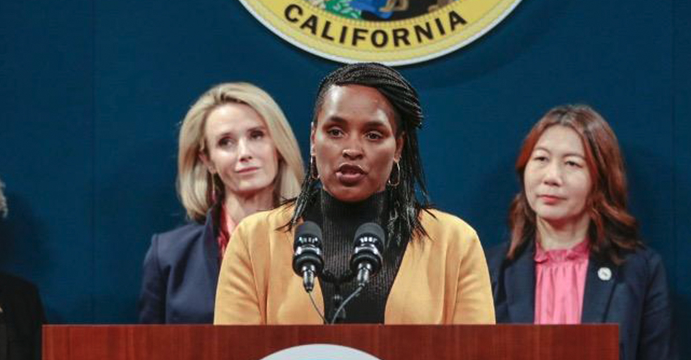 Kimberley Ellis, Director of the San Francisco Department on the Status of Women speaking at a press conference March 14 in Sacramento. Standing behind her is First Partner Jennifer Newsom and Government Operations Secretary Amy Tong. Photo by Felicia Rule.