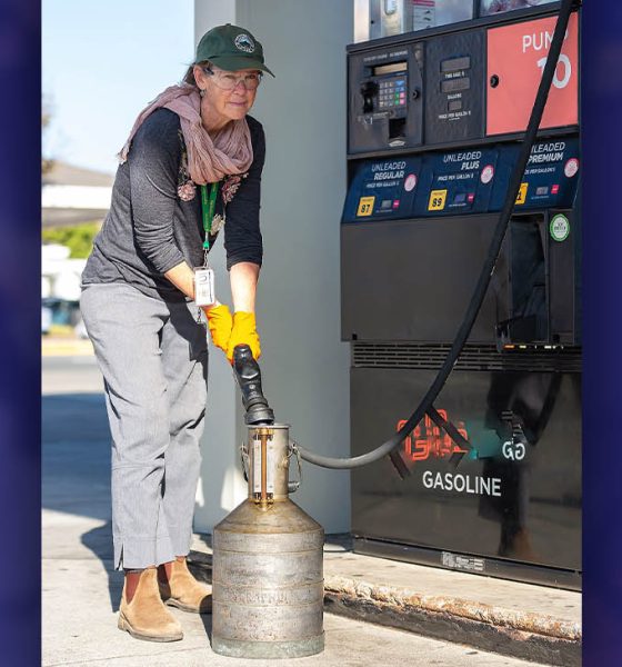 Johanna Good, an inspector with Agriculture / Weights & Measures, checks volume accuracy at a service station pump.