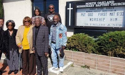Family and members gather outside North Oakland Missionary Baptist Church. Front row, from left to right: Timothy Rutledge. Jr., grandson of Pastor Sylvester Rutledge; his daughter, J.M. Hale; First Lady Audrey Golden Rutledge, and Pastor Rutledge. Back row from left to right: church members Chavonne Robinson, Clarence Wells of the Golden Light Ministries feeding program, and the pastor's son Timothy Rutledge, Sr. Photo by Carla Thomas.