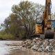 Work is done to repair a levee break near the township of Pajaro in Monterey County, Calif., on March 13, 2023. Waters from the Pajaro River breached the levee around midnight on March 10, 2023. (Ken James/California Department of Water Resources via Bay City News)