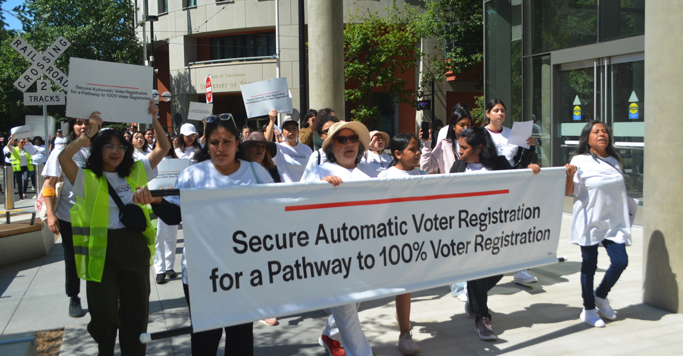 The California Grassroots Democracy Coalition held the "Day of Democracy In Support of Secure Automatic Voter Registration" rally and march on June 14, 2023. The participants marched around the California Secretary of State building (in the background) in Sacramento. CBM photo by Antonio Ray Harvey.