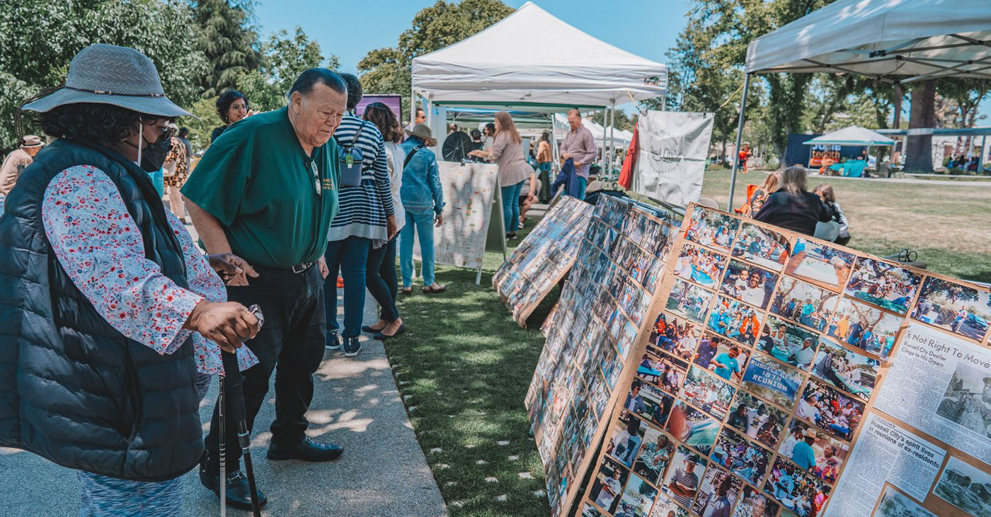 Observing a display at a recent Juneteenth in Hayward. Juneteenthhayward.com photo.