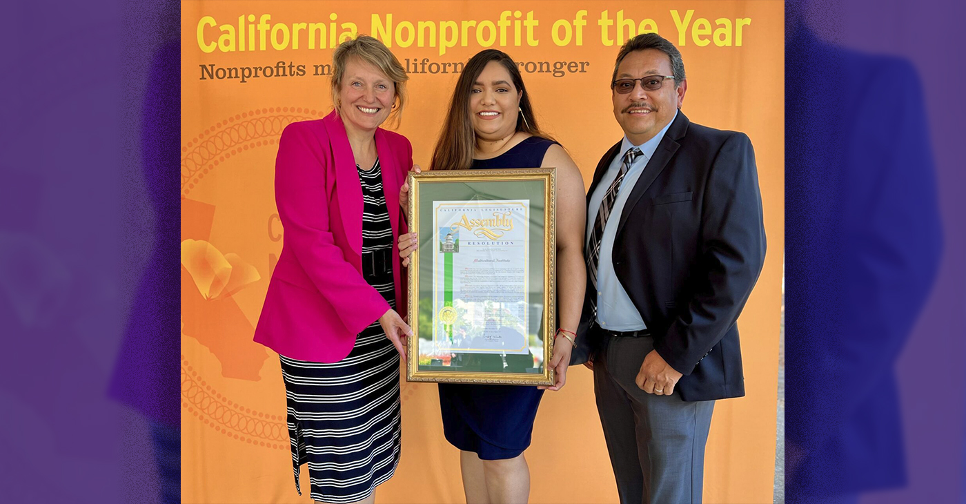 Representatives of the Multicultural Institute hold the resolution given to them by California State Assemblymember Buffy Wicks. Photo courtesy of the Multicultural Institute.