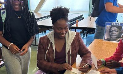 Tianna Bartoletta signs an autograph for a Nystrom student. Photo courtesy of WCCUSD.