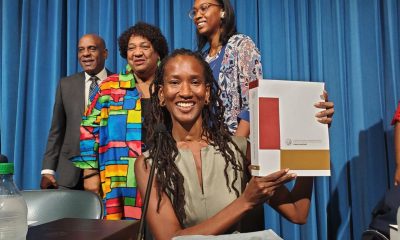 Lisa Holder, Oakland-based attorney and member of the California Reparations Task Force, holds up the 1075-page final report. The nine-member panel submitted 115 recommendations to the California Legislature two days before the June 30 deadline. CBM photo by Antonio Ray Harvey.