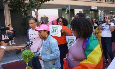 Congresswoman Barbara Lee, wearing a pink hat, and California Attorney General Rob Bonta lead the Oakland Pride Parade. Photo by Gene Hazzard.