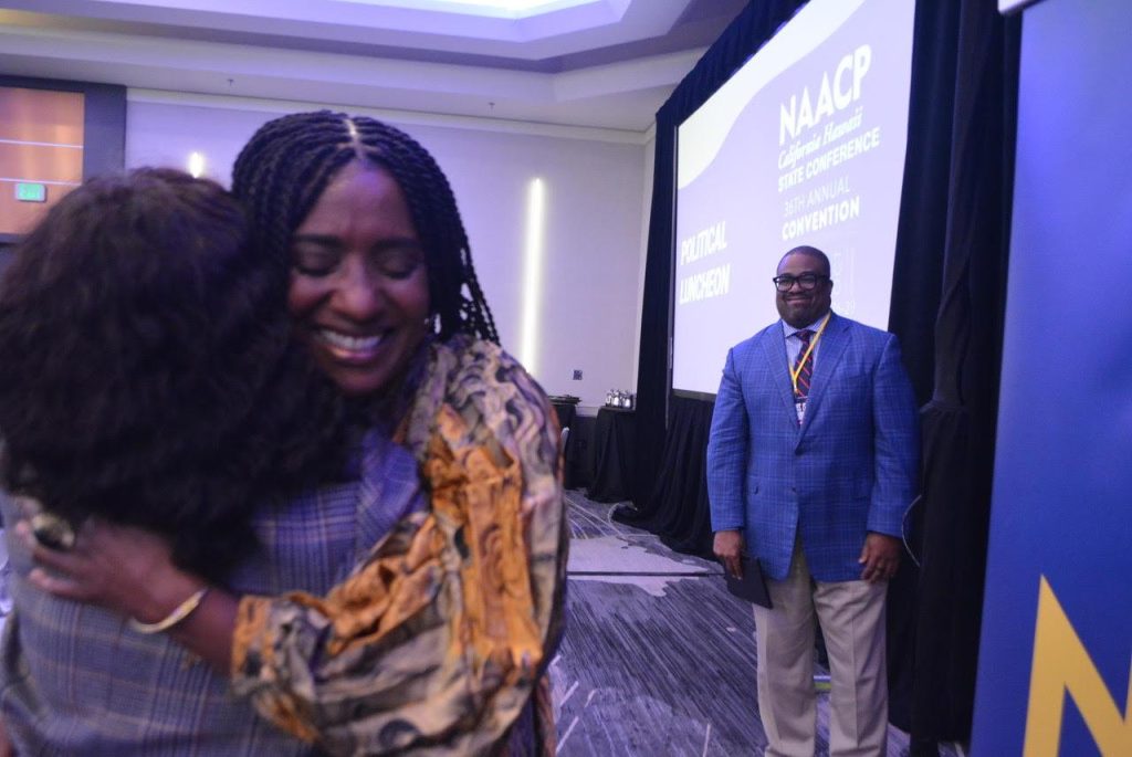 Oakland City Councilwoman Treva Reid receives a passionate hug after her speech during the NAACP’s political Luncheon on Oct. 28, 2023. Photo by Antonio Ray Harvey.