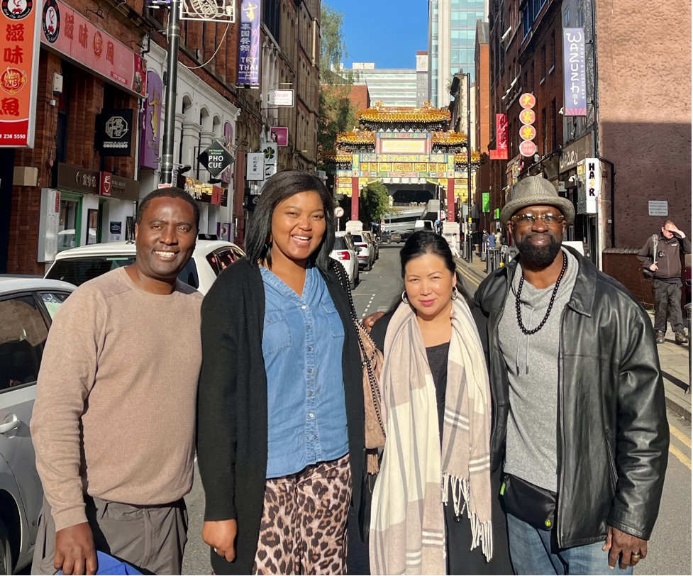 (L-R) Dr. Ronnie Chikwama, Constance Chikwama, Dr. Maritony Jones, Amb. Jonathan Fitness Jones in Chinatown, Manchester England (UK) after Oakland-Bolton Sister Cities International meetings