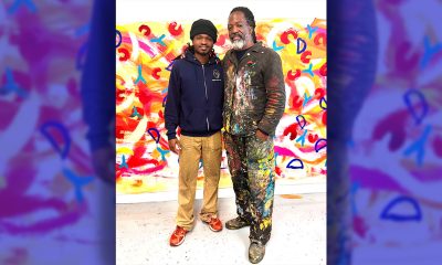 Upcoming artist Osaze Seneferu with his father, renowned painter Malik Seneferu. Photo by Linda Parker Pennington.
