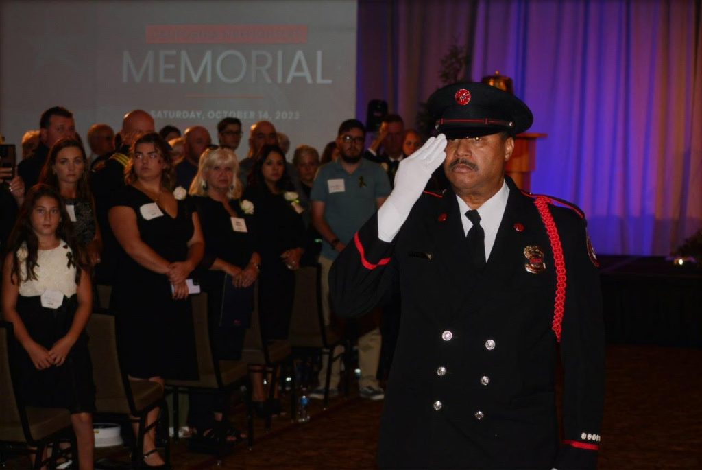 Thomas Jay, retired Fire Battalion Chief for Riverside, leads the indoor procession at the California Firefighters Memorial Ceremony at the Sheraton Grand Hotel in Sacramento. The event honored 35 firefighters who died in the line of duty. Photo by Antonio Ray Harvey.