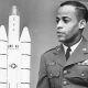 Capt. Edward J. Dwight, Jr., the first African American selected as a potential astronaut, looks over a model of Titan rockets in November 1963. Bettmann Archive / Getty Images.