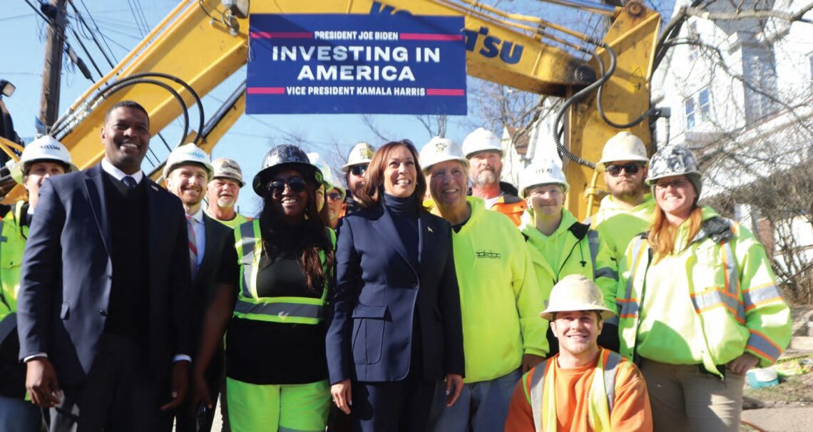 Vice President Kamala Harris takes a group photo with lead pipe replacement workers in Pittsburgh’s Elliott neighborhood, Feb. 20, 2024. Also pictured at far left is EPA Administrator Michael Regan. (photo by Rob Taylor Jr.)