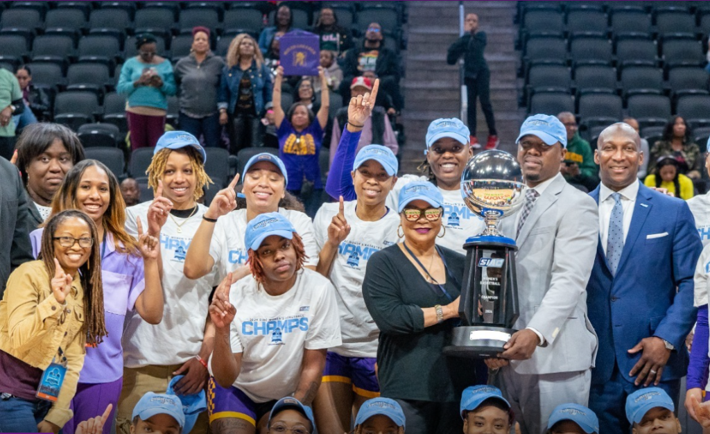 Miles College President Bobbie Knight, holding trophy, celebrates with the Lady Bears women’s basketball team after they captured their first SIAC tournament championship. (Miles College)