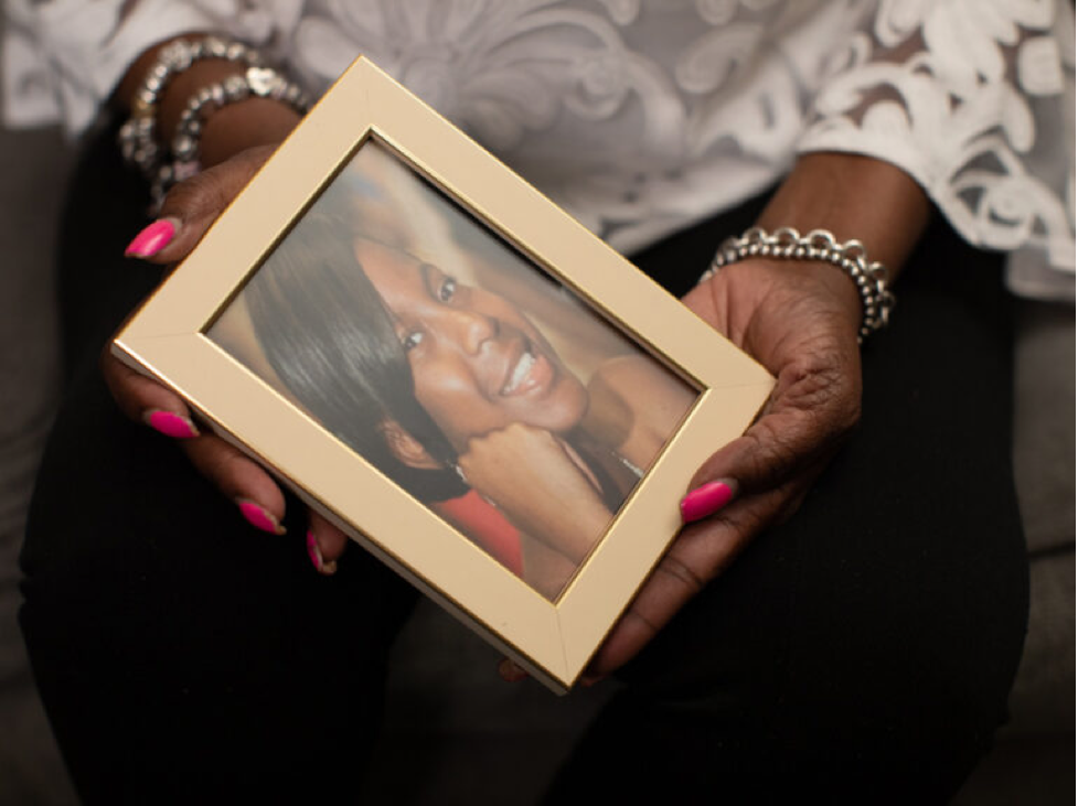 Tammy Pittman holds a portrait of her daughter, Shante Bonahan. Pittman says police asked her to wait 24 hours before reporting her daughter missing in 2016, even though her daughter had called in distress. (Photo: Natasha Moustache)