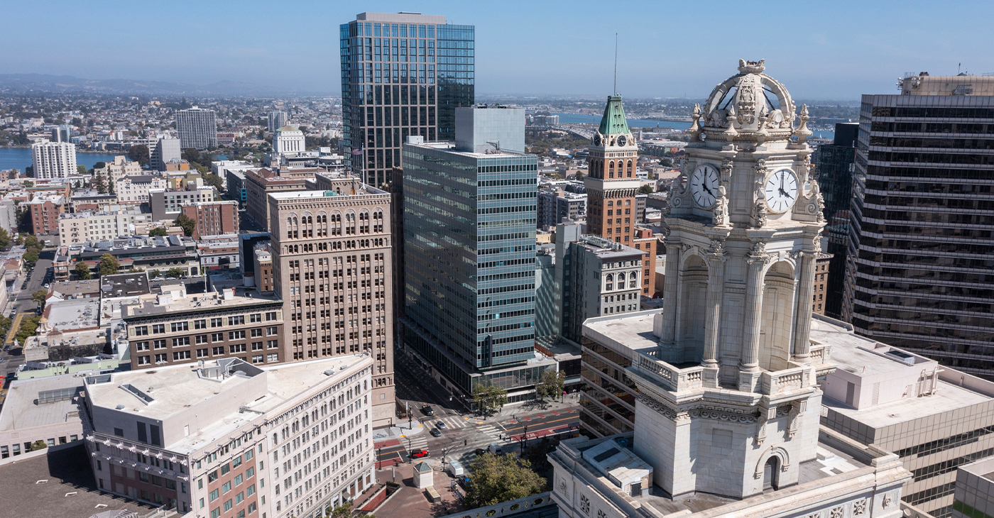Skyline aerial view of the urban core of downtown Oakland, California. Credit to MattGush, iStock