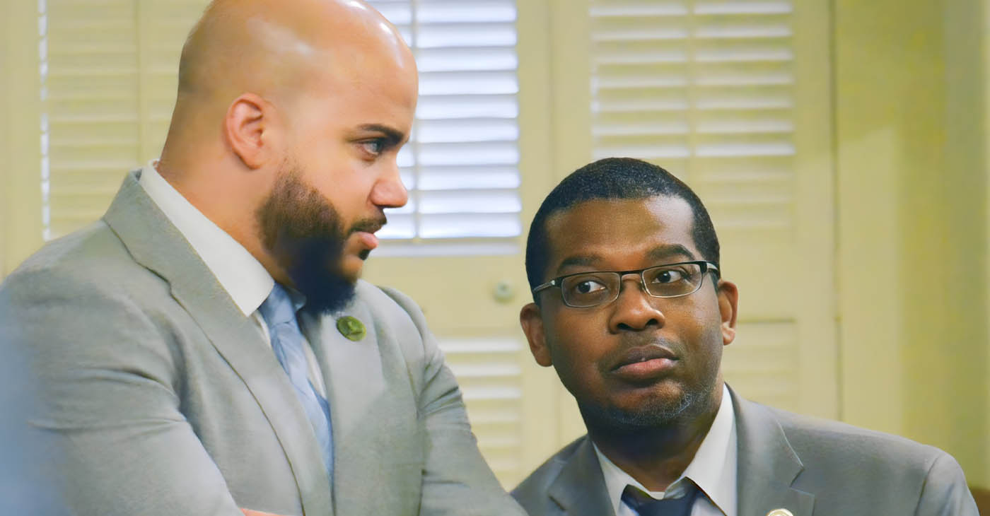 Asm. Corey Jackson 9D-Moreno Valley), right, has a brief conversation with Asm. Issac Bryan (D-Ladera Heights), left, on the Assembly floor at the State Capitol on June 27 after Jackson has a near confrontation with Asm. Bill Essayli (R-Corona). CBM photo by Antonio Ray Harvey.