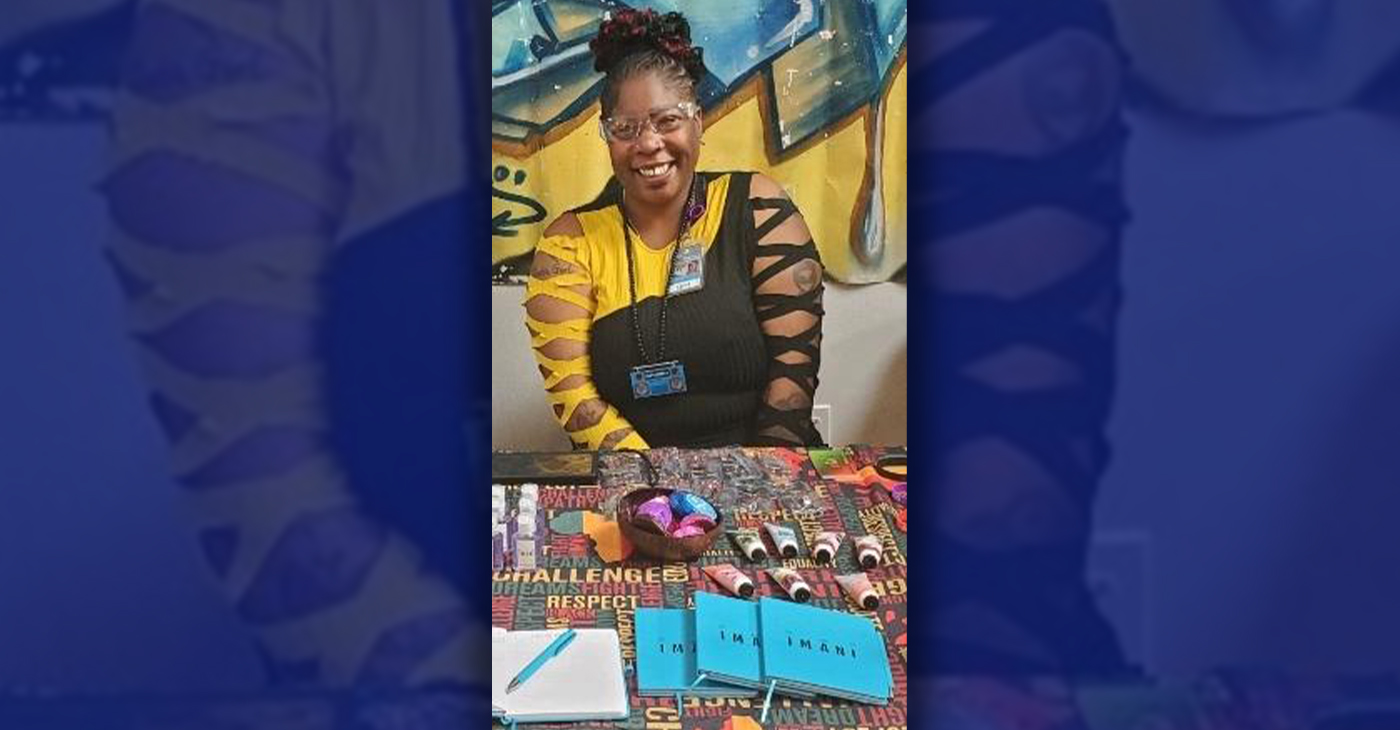 Health worker Ebony Atlas distributes information about the OMI Family Center's IMANI Program in San Francisco. The organization participated in the inaugural San Francisco Hip Hop Festival at the Midway in San Francisco. Photo By Carla Thomas.