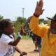 The Oakland Black Cowboys Association will hold an event to teach children the love of riding at Fairyland on Feb. 14. Here, a member of the OBCA high-fives a young rider at an event in 2021. Facebook photo.