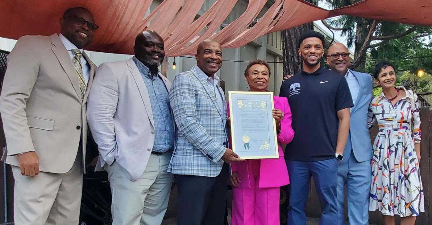 At D. Monaghan’s on the Hill, a resolution declaring April 9 ‘100 Black Men of the Bay Area Day’ was witnessed by (l.-r.) 100 Black Men leaders Maurice Harold, Marco T. Lindsey, Danny Lee Williams, Oakland Mayor Barbara Lee, Oakland City Council President Kevin Jenkins, Port of Oakland Commissioner Derek Mohammad, and Oakland Councilmember Janani Ramachandran. Photo by Carla Thomas.