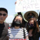 Patricia Roque (far right) pictured with her family at a Stop Asian Hate rally after her father's assault (far left). (Courtesy of AAPI Equity Alliance)