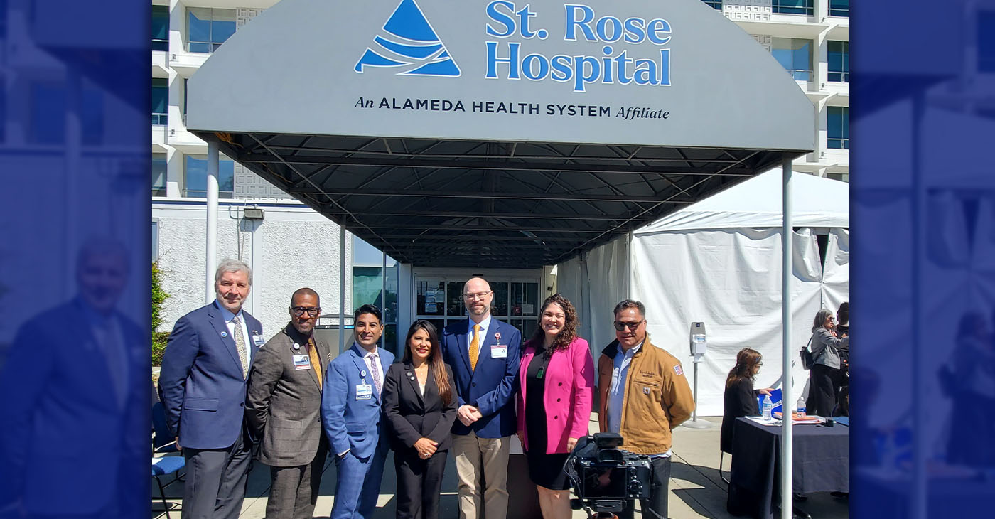 At St. Rose Hospital in Hayward, Alameda Health System and Stanford Announce Partnership.(L-R) Mark Fratzke, COO Alameda Health System (AHS), James Jackson, CEO AHS, Richard Espinoza, chief administrative officer AHS, California Assemblymember Liz Ortega (D-San Leandro), Rick Shumway, COO Stanford Health Care (SHC), Alameda County Supervisor Elisa Márquez, and Hayward Mayor Mark Salinas. Photo by Carla Thomas.