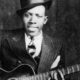 Robert Johnson (1911-1938) is thought of as the godfather of blues music, especially Delta blues. The 29 songs recorded by him during his short life have been of massive inspiration to guitarists and musicians over the last 80 years. Public domain photo.